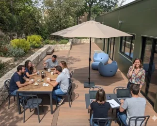 Terrasse aménagée du centre d'affaires BURO Club Partner Aix Éguilles avec mobilier de jardin, parasol et coworkers travaillant en extérieur.