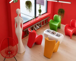 Espace lounge coloré au BURO Club Partner Beaune avec murs rouges, fauteuils design contemporains multicolores et baies vitrées.